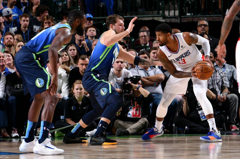 Paul George, Los Angeles Clippers, guarded by Luka Doncic, Dallas Mavericks