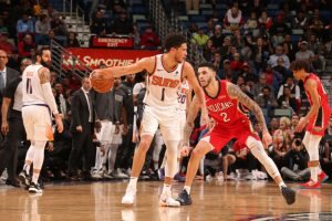 Devin Booker, Phoenix Suns, guarded by Lonzo Ball, New Orleans Pelicans