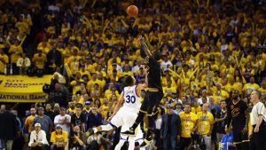 Kyrie Irving, #2, shoots over Steph Curry, #30